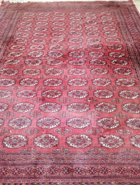 A large Tekke Bokhara red ground carpet Approx. 360 x 280cm